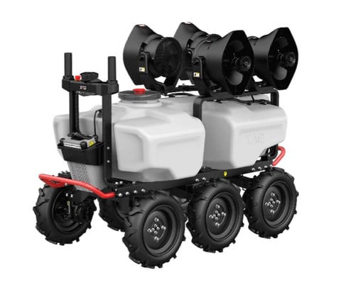 Red and black agricultural robot with large tires, white water tanks, and multiple black spray nozzles on top